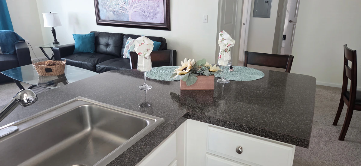 Kitchen counter and cabinets in a furnished two bedroom apartment in Simpsonville, SC